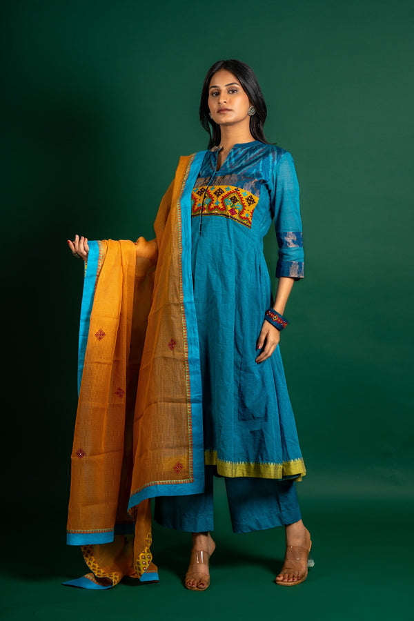 Blue handloom Kali top paired with ikat and Kutch work on yoke with mustard dupatta with work and pant