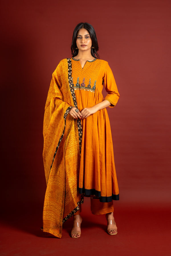 Saffron shade handloom Kali top with kalamkari with tiny mirror work, delicate zari work on neck with Maheshwari dupatta and pant