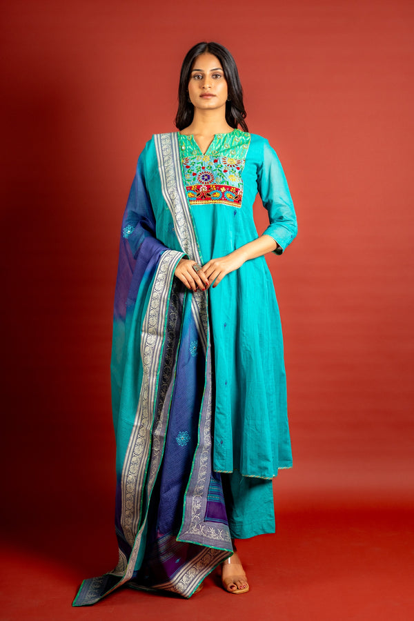 Vibrant turquoise blue kali handloom top, multicolour thread embroidery with mirror work on yoke and tie and dye shaded dupatta with work and self colour pant