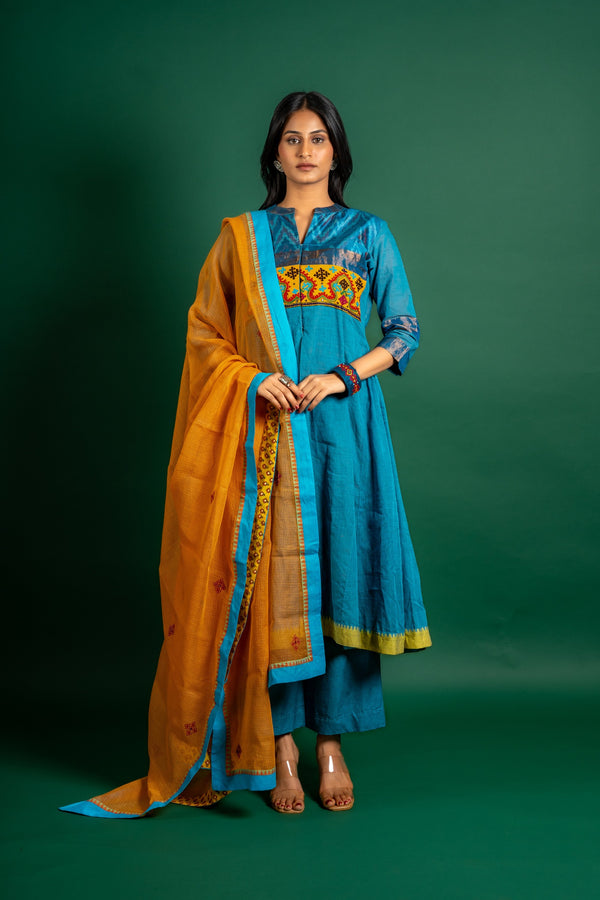 Blue handloom Kali top paired with ikat and Kutch work on yoke with mustard dupatta with work and pant