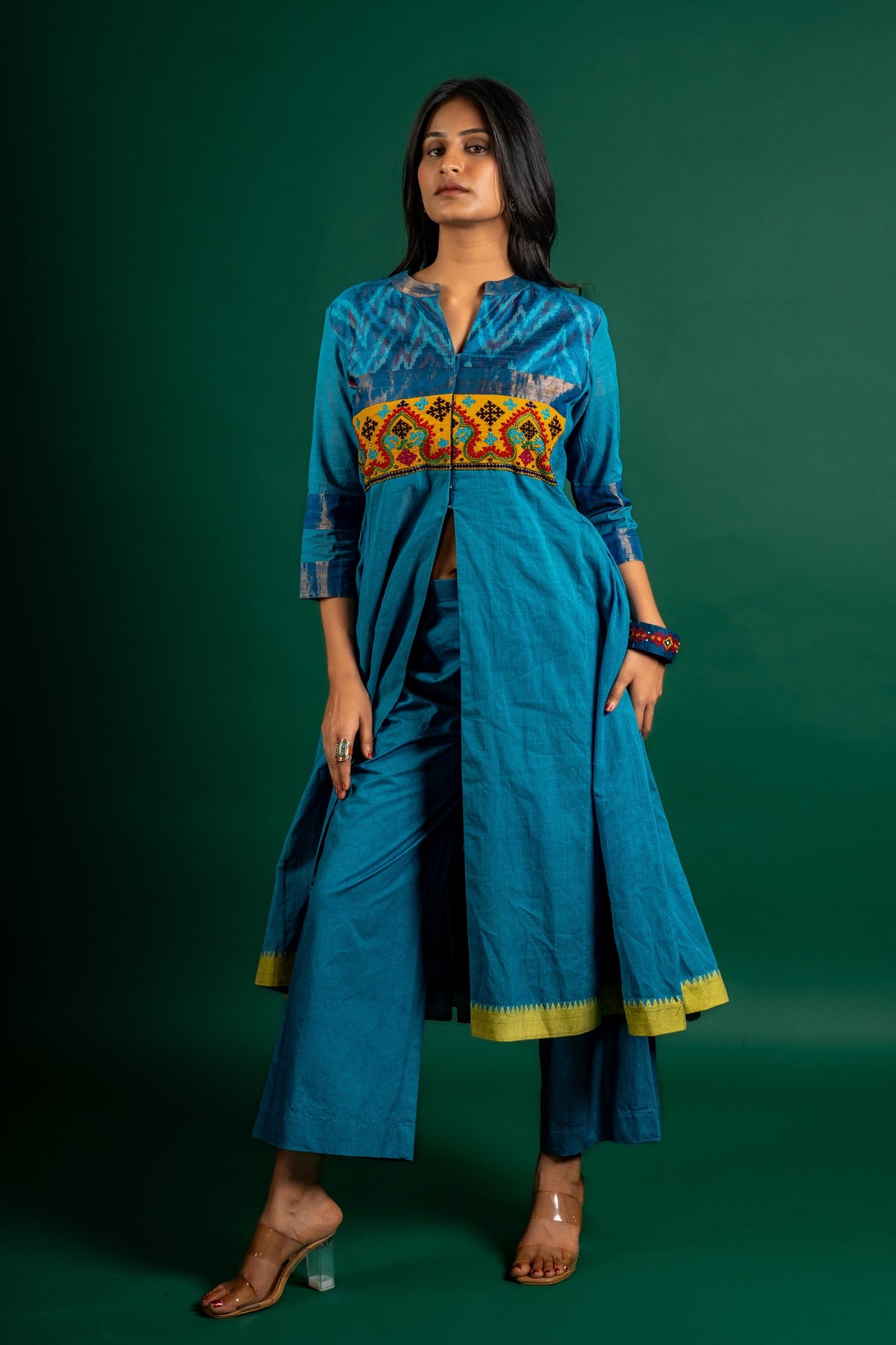 Blue handloom Kali top paired with ikat and Kutch work on yoke with mustard dupatta with work and pant