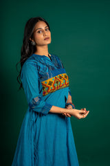 Blue handloom Kali top paired with ikat and Kutch work on yoke with mustard dupatta with work and pant