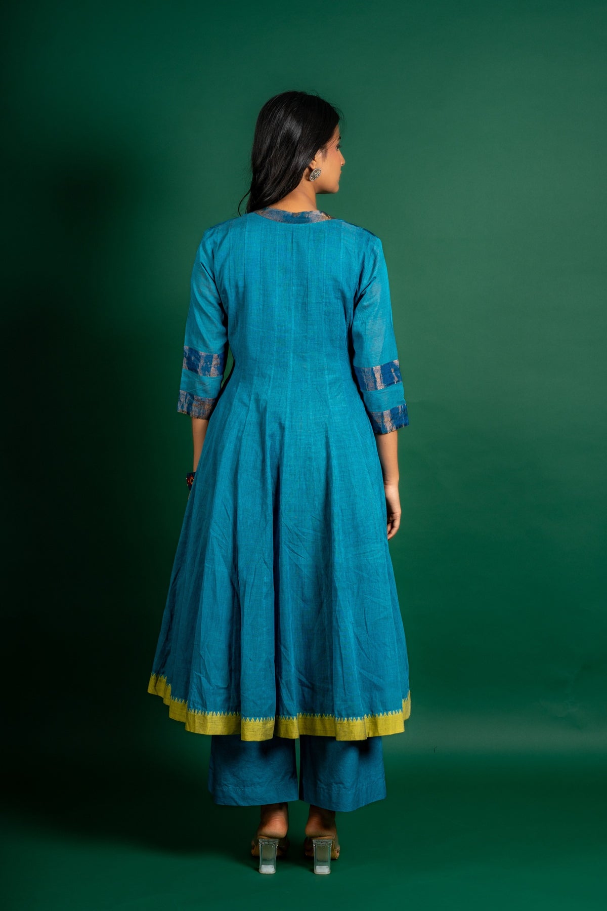Blue handloom Kali top paired with ikat and Kutch work on yoke with mustard dupatta with work and pant