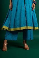 Blue handloom Kali top paired with ikat and Kutch work on yoke with mustard dupatta with work and pant