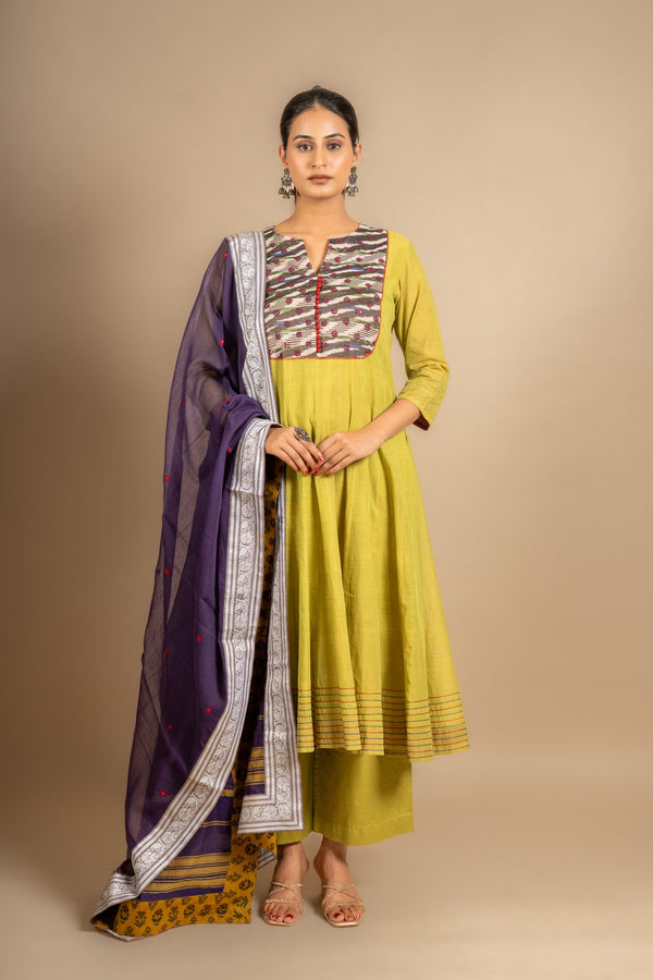 Green handloom Kali top ikat yoke with thread and mirror work and Daman anchor lines, purple Kota dupatta with work, cotton pant