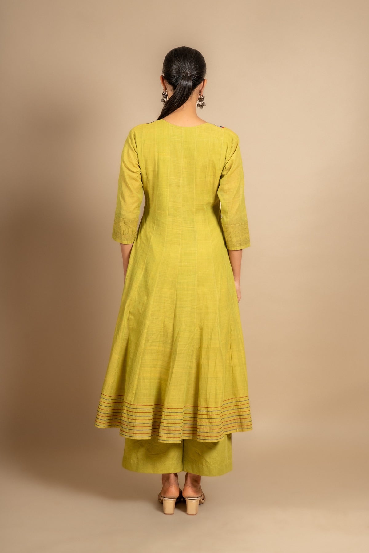 Green handloom Kali top ikat yoke with thread and mirror work and Daman anchor lines, purple Kota dupatta with work, cotton pant