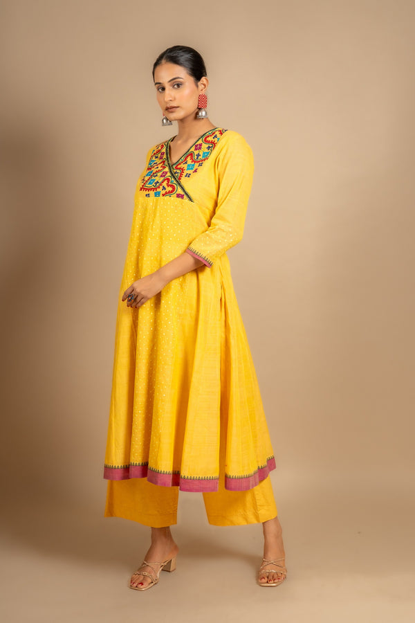 Yellow handloom Kali top with Kutch work overlap on yoke and front panel, tiny mirror work with cotton pant
