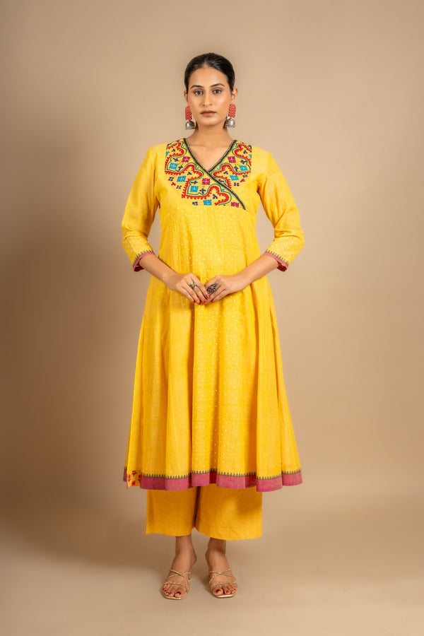 Yellow handloom Kali top with Kutch work overlap on yoke and front panel, tiny mirror work with cotton pant