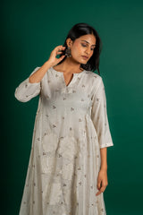 Off white Chanderi cotton panel frock with Mukesh work and centre panel patch work