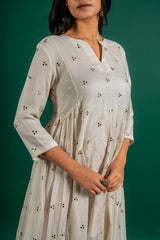 Off white Chanderi cotton panel frock with Mukesh work and centre panel patch work