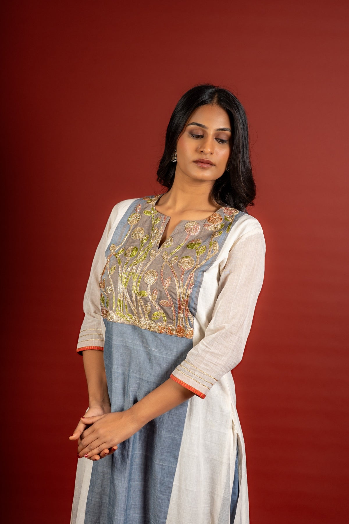 Grey and off white panel handloom top with Gota lace work on yoke in Daman zari pita work and grey Kota dupatta with work and cotton pant