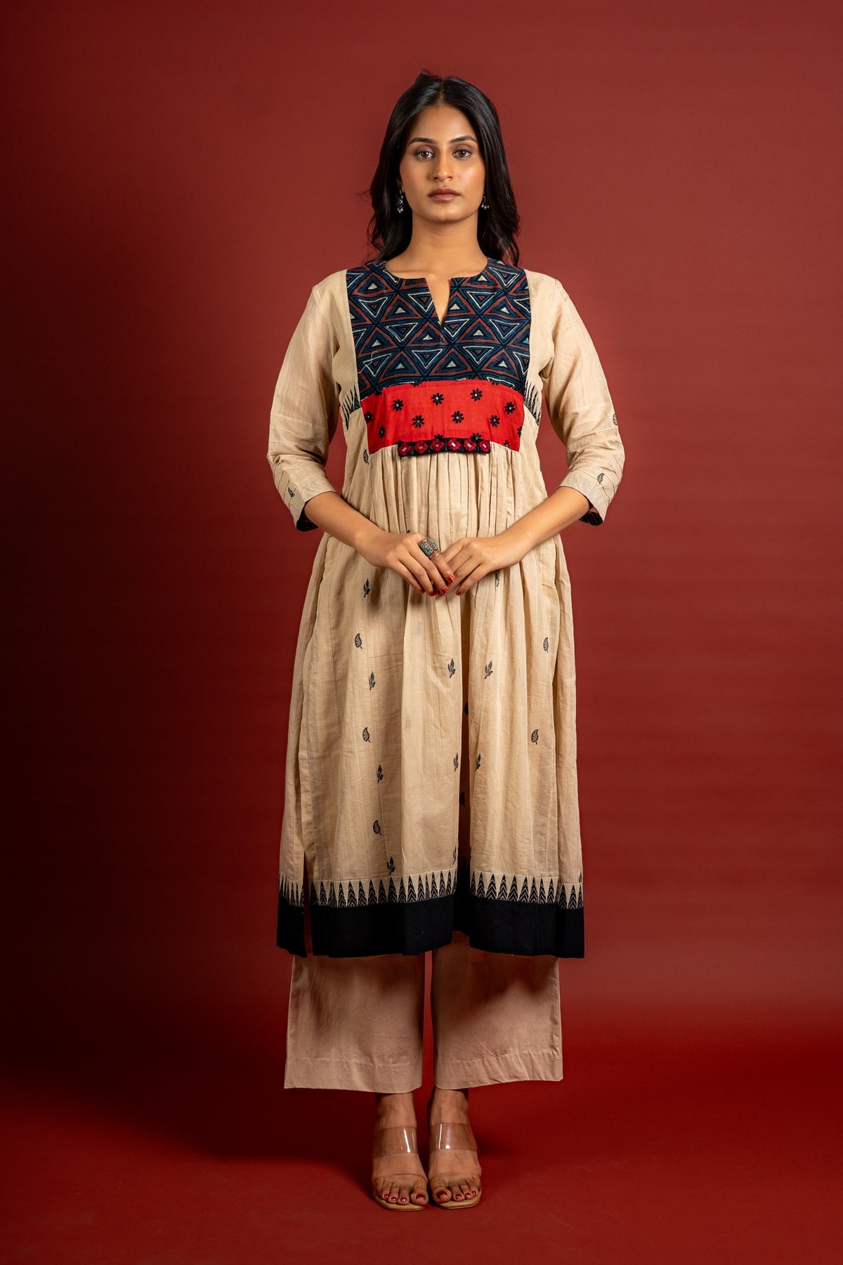 Beige shade with black thread butta in the centre, a temple border on the Daman, and thread with mirror detailing on the yoke, cotton pant