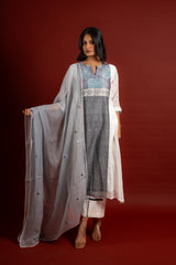 Off white and grey panel handloom top, kanta work on yoke with grey Kota dupatta with mirror work, tie and dye pant