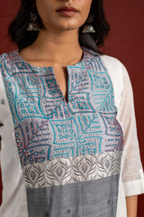 Off white and grey panel handloom top, kanta work on yoke with grey Kota dupatta with mirror work, tie and dye pant