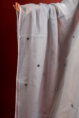 Off white and grey panel handloom top, kanta work on yoke with grey Kota dupatta with mirror work, tie and dye pant
