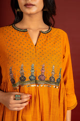 Saffron shade handloom Kali top with kalamkari with tiny mirror work, delicate zari work on neck with Maheshwari dupatta and pant