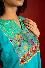 Vibrant turquoise blue kali handloom top, multicolour thread embroidery with mirror work on yoke and tie and dye shaded dupatta with work and self colour pant