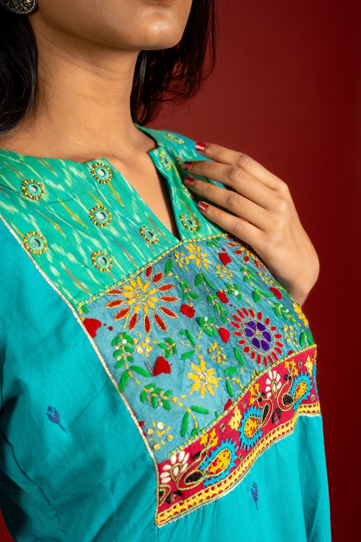 Vibrant turquoise blue kali handloom top, multicolour thread embroidery with mirror work on yoke and tie and dye shaded dupatta with work and self colour pant