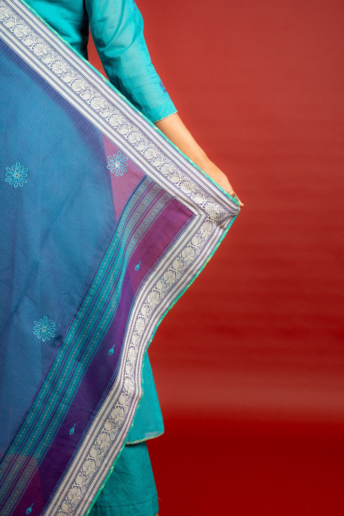 Vibrant turquoise blue kali handloom top, multicolour thread embroidery with mirror work on yoke and tie and dye shaded dupatta with work and self colour pant