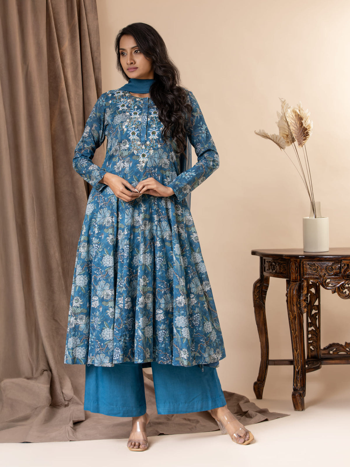 Blue floral printed kali top in muslin with intricate hand embroidery detailing, paired with a dupatta and pants