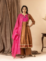 Handwoven brown top with silver zari buti, gathered kali design, and Gujari work with sequin detailing on the yoke