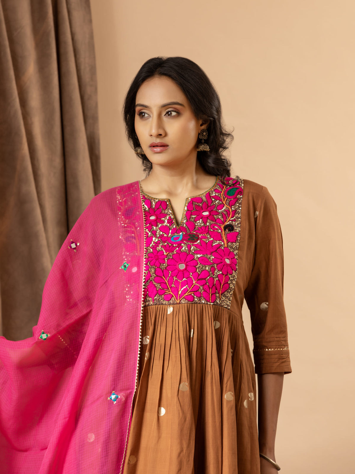 Handwoven brown top with silver zari buti, gathered kali design, and Gujari work with sequin detailing on the yoke