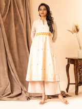 Handwoven panel top in creamy peach with thread and mirror work, paired with matching pants