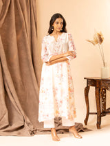 Ivory floral printed Chanderi straight cut top with embroidery on the yoke, paired with stretchable Lycra pants
