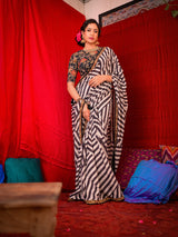 Make a Splash with Stylish Striped Saree and Printed Blouse