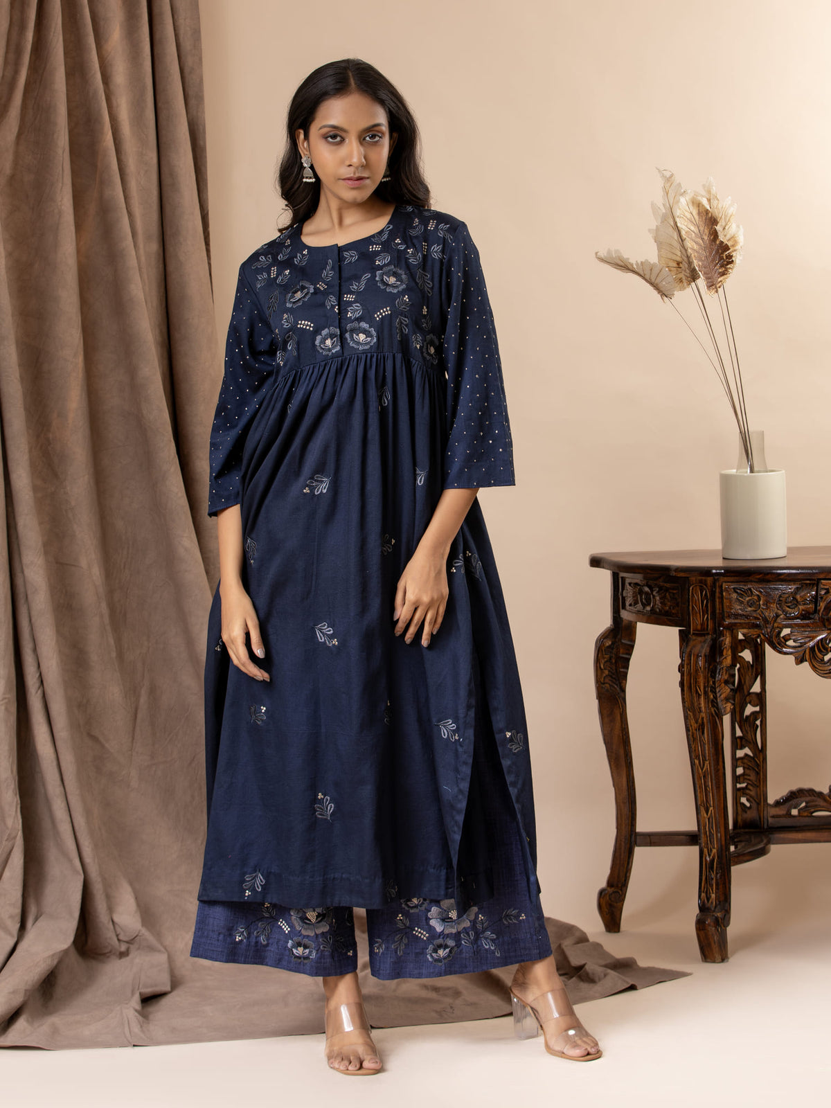 Midnight blue Chanderi gathered top with a floral thread embroidered yoke and all-over embroidery, paired with pants featuring thread embroidery