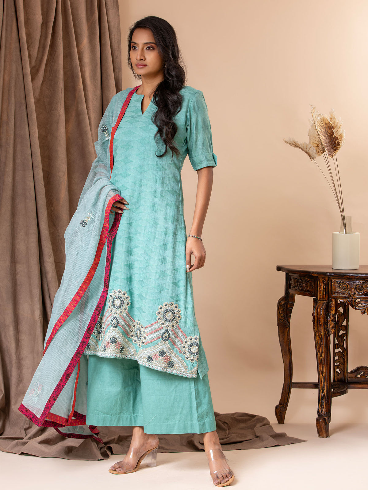 Mint green self-weaving fabric kurti with applique work on the daman, paired with a Kota dupatta featuring applique detailing