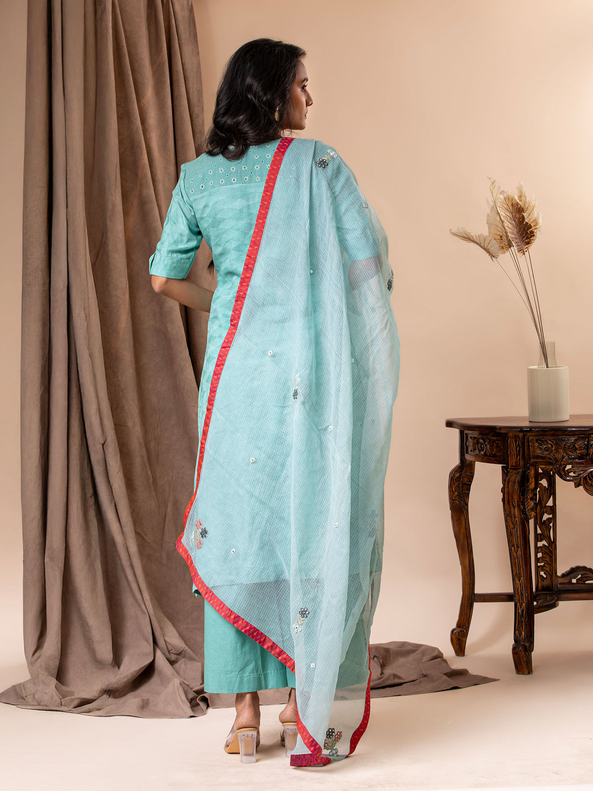 Mint green self-weaving fabric kurti with applique work on the daman, paired with a Kota dupatta featuring applique detailing