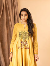 Mustard yellow handwoven dress with zall over zari bhuti and thread embroidery on the yoke.