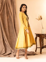 Mustard yellow handwoven dress with zall over zari bhuti and thread embroidery on the yoke.