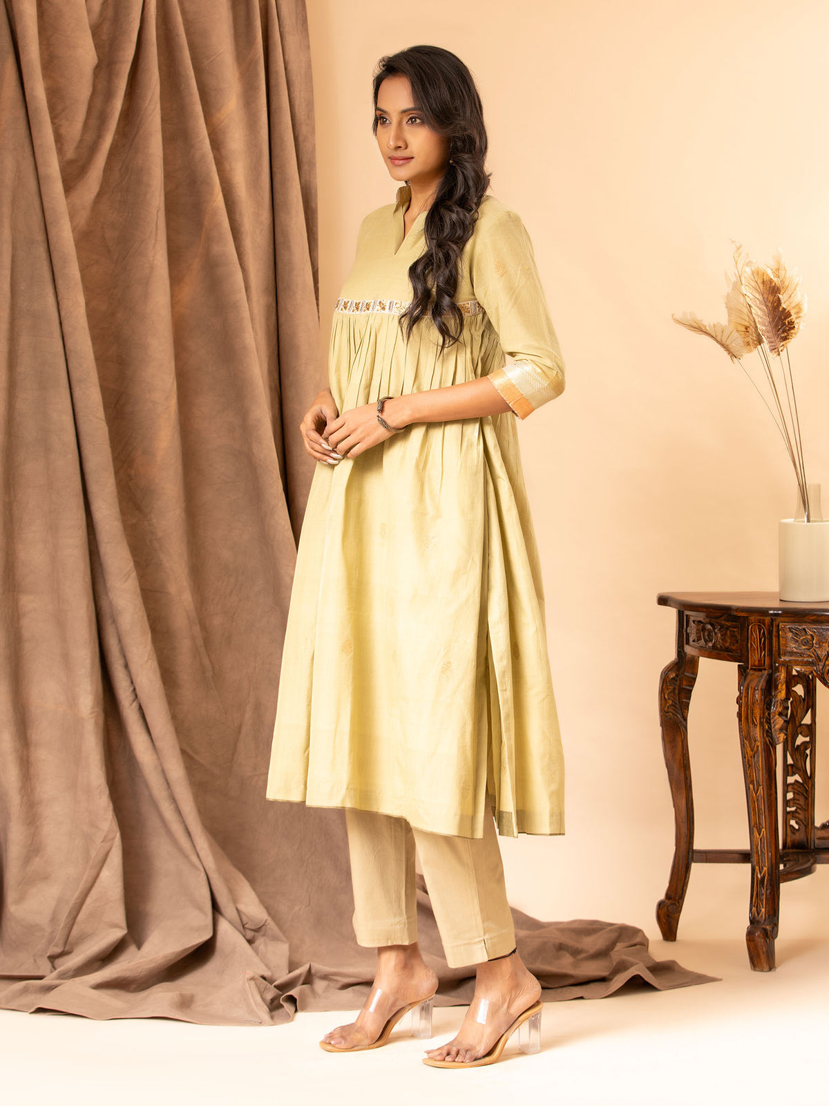 Muted sage handwoven gathered top with zari and silver bhuti, mirror and zari work detailing, paired with self-coloured pants