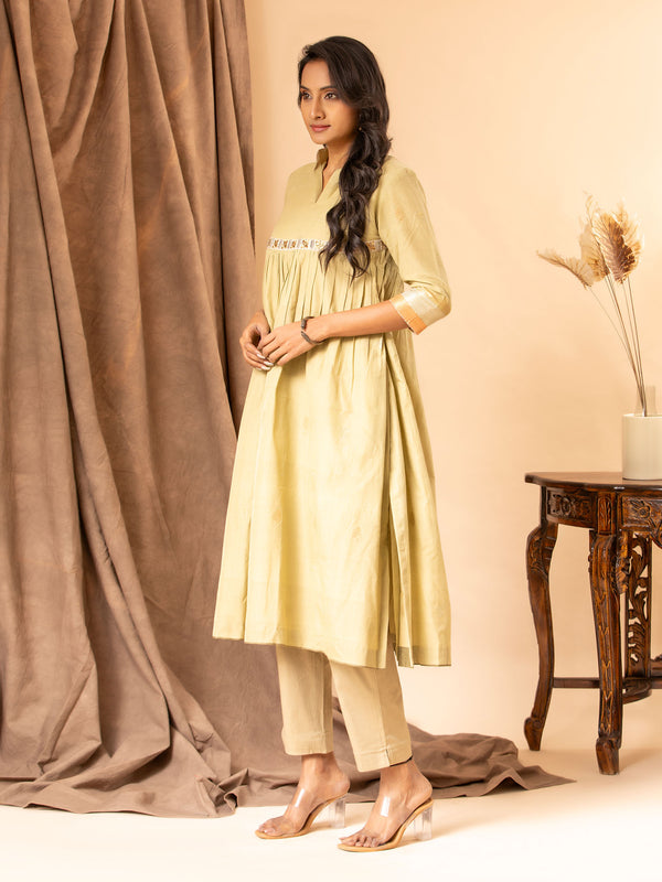 Muted sage handwoven gathered top with zari and silver bhuti, mirror and zari work detailing, paired with self-coloured pants