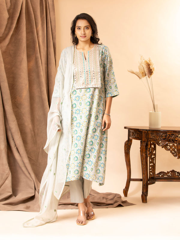 Printed linen top with handembroidered thread and mirror work on the yoke, paired with a Kota dupatta featuring thread work and matching pants.