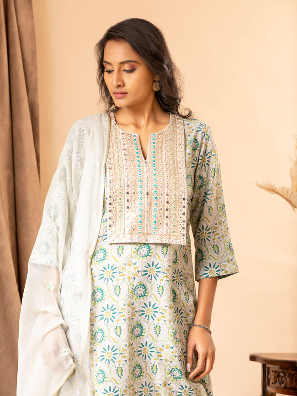 Printed linen top with handembroidered thread and mirror work on the yoke, paired with a Kota dupatta featuring thread work and matching pants.