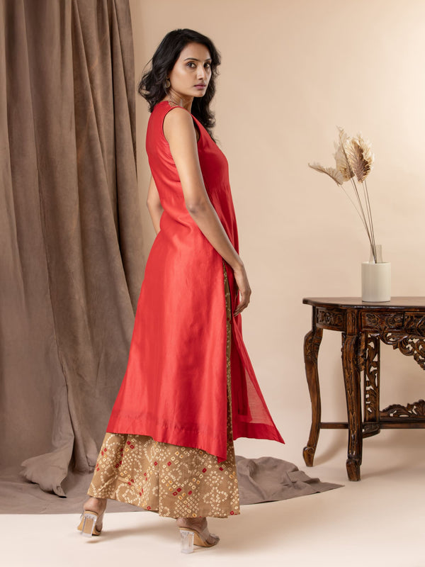 Scarlet red Chanderi straightcut top with sequin and coin work detailing on the neckline, paired with Bandhani pants