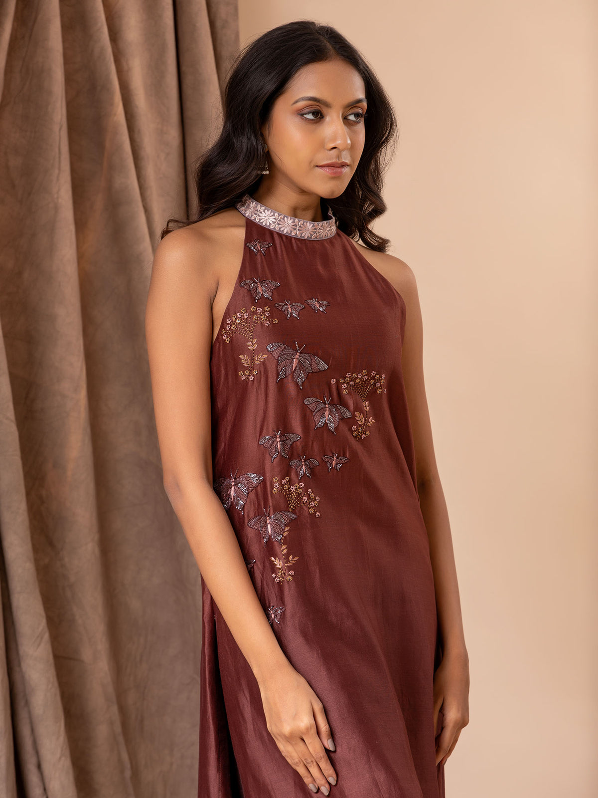 Shaded brown Chanderi halter neck straight-cut top with butterfly hand embroidery detailing, paired with pants.