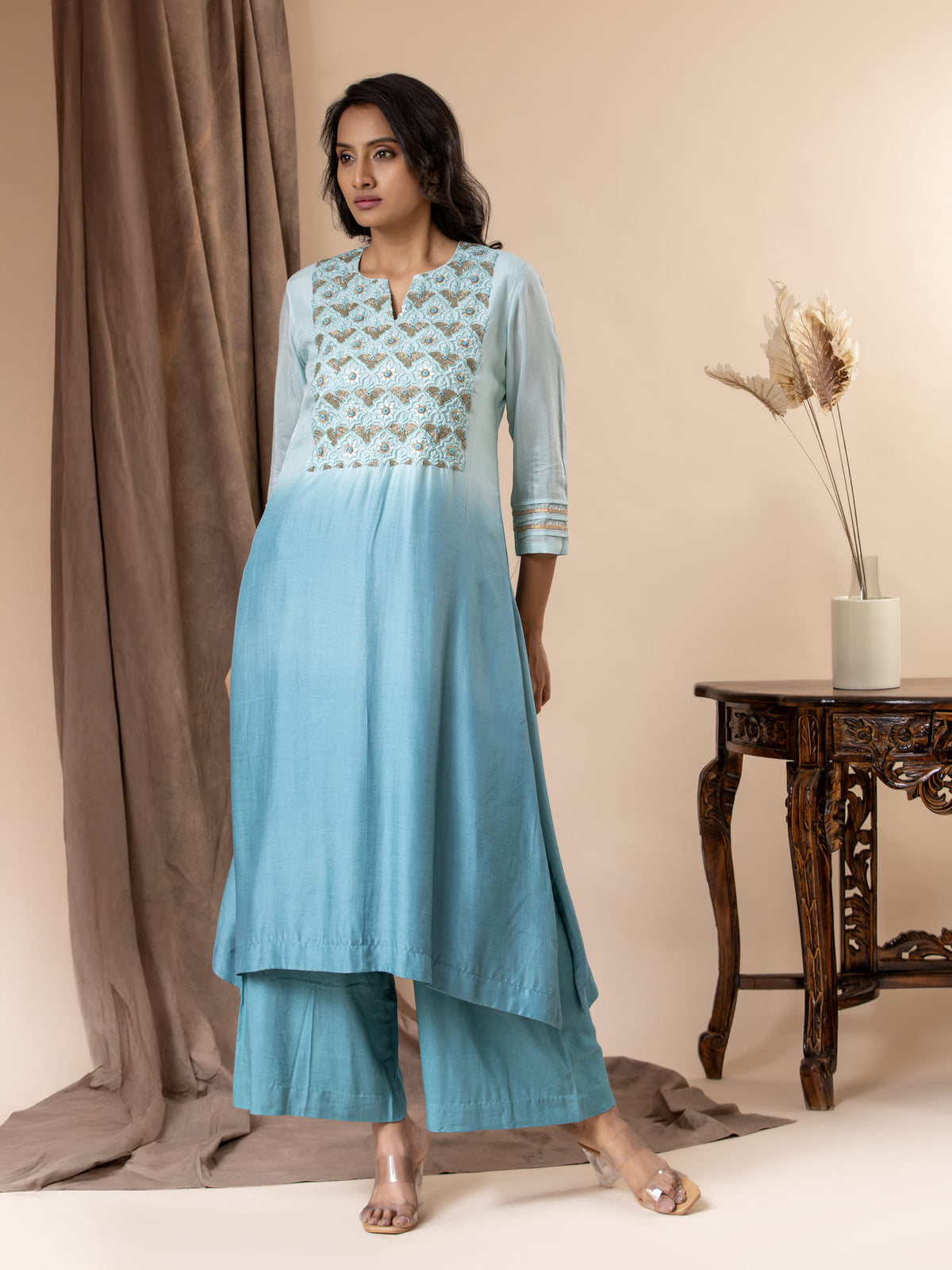 Shaded sky to light blue muslin top with Gota Patti work, cutdana detailing, and thread work hand embroidery, paired with pants