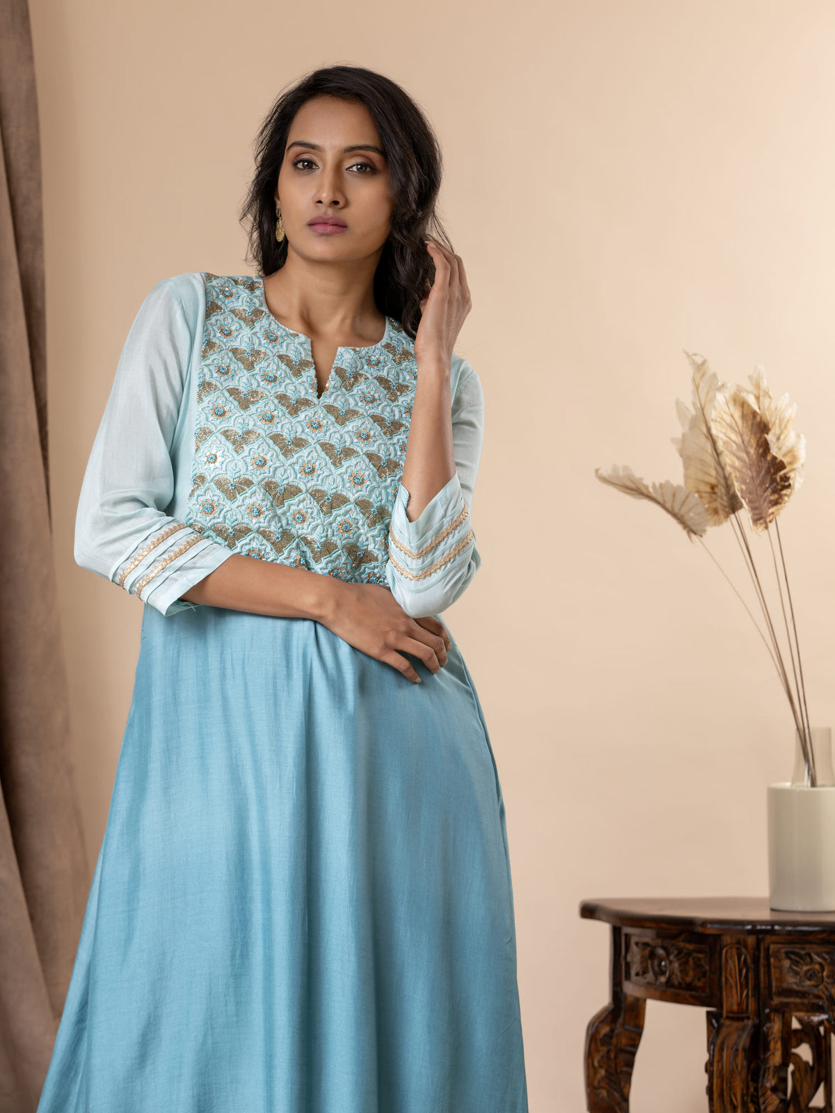 Shaded sky to light blue muslin top with Gota Patti work, cutdana detailing, and thread work hand embroidery, paired with pants