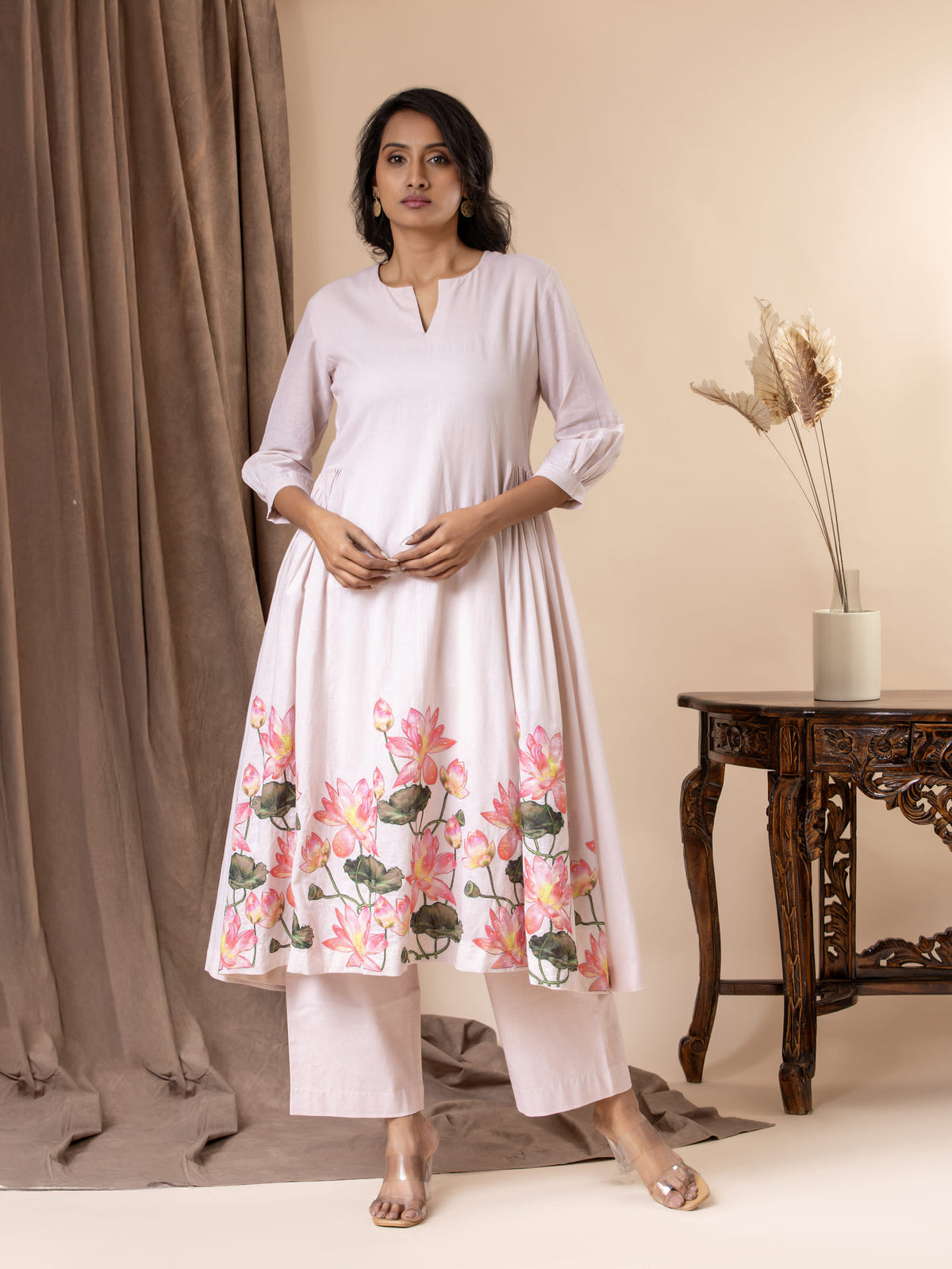 Soft blush pink mul gathered top with lotus applique work, highlighted with sequins, paired with pants