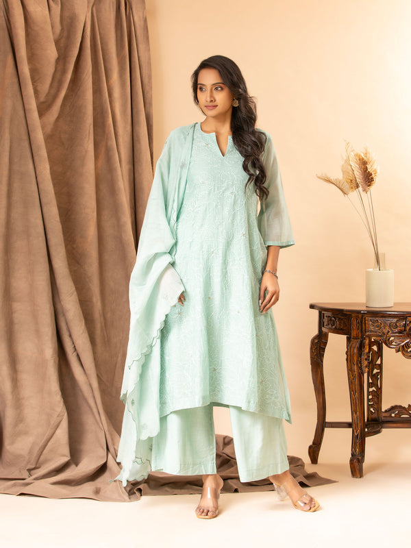 Soft mint green cotton Chanderi top with all-over thread work, highlighted with sequins, paired with a dupatta featuring thread butti