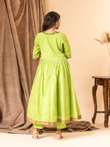 Vibrant green handwoven gathered top with tiny mirror and Kutch work on the yoke, paired with matching pants