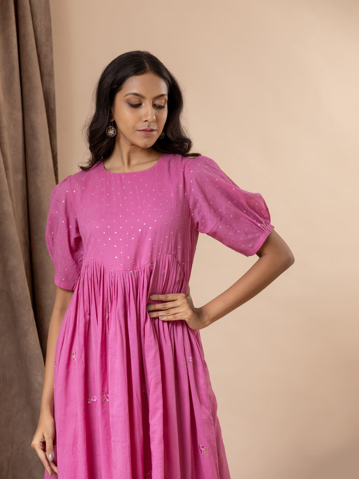 Vibrant pink mul cotton frock with tiny mirrors on the yoke, pleated detailing, puffed sleeves, and thread bhuttis