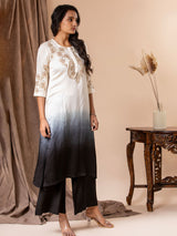 White to black ombre-shaded linen satin straight-cut top with detailed Gota hand embroidery, paired with black pants.