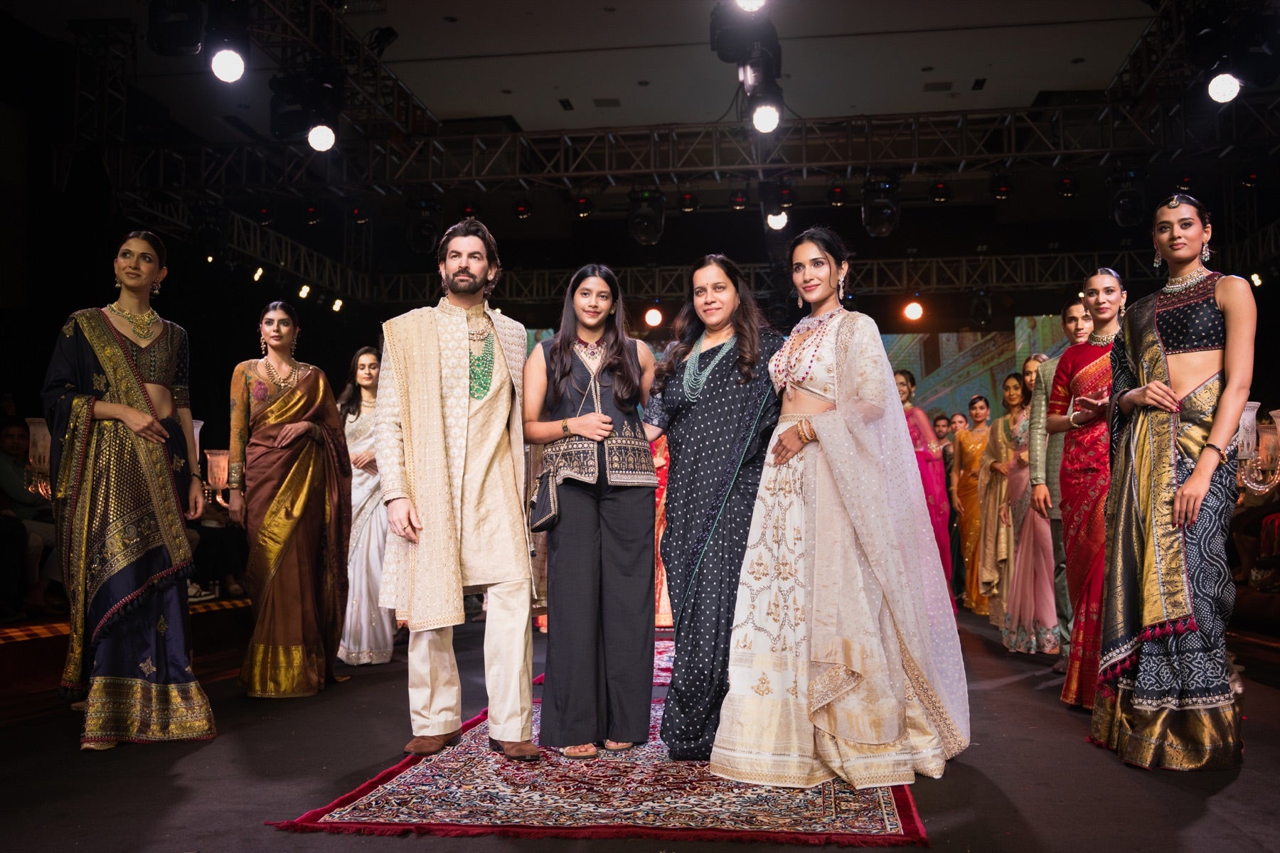 The designer and team closing the show on the runway
