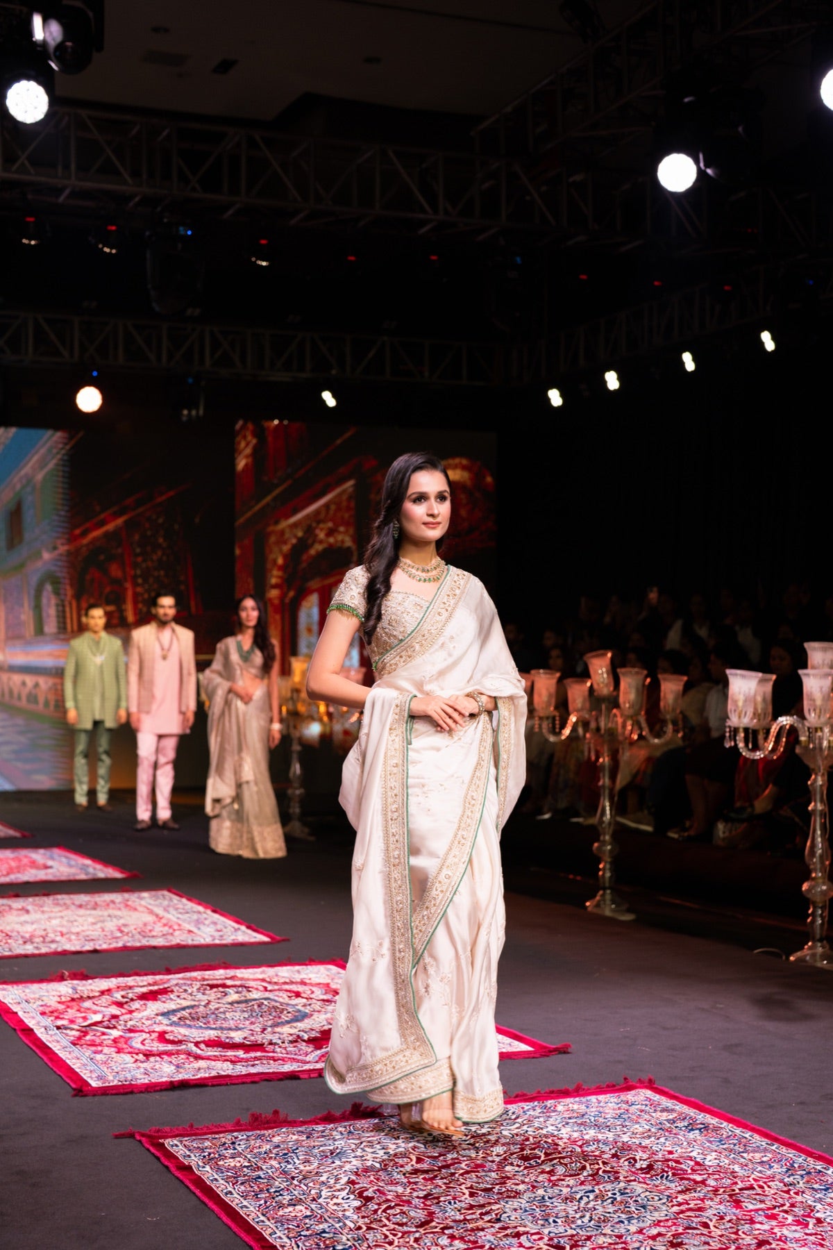 Model in an ivory saree on the runway