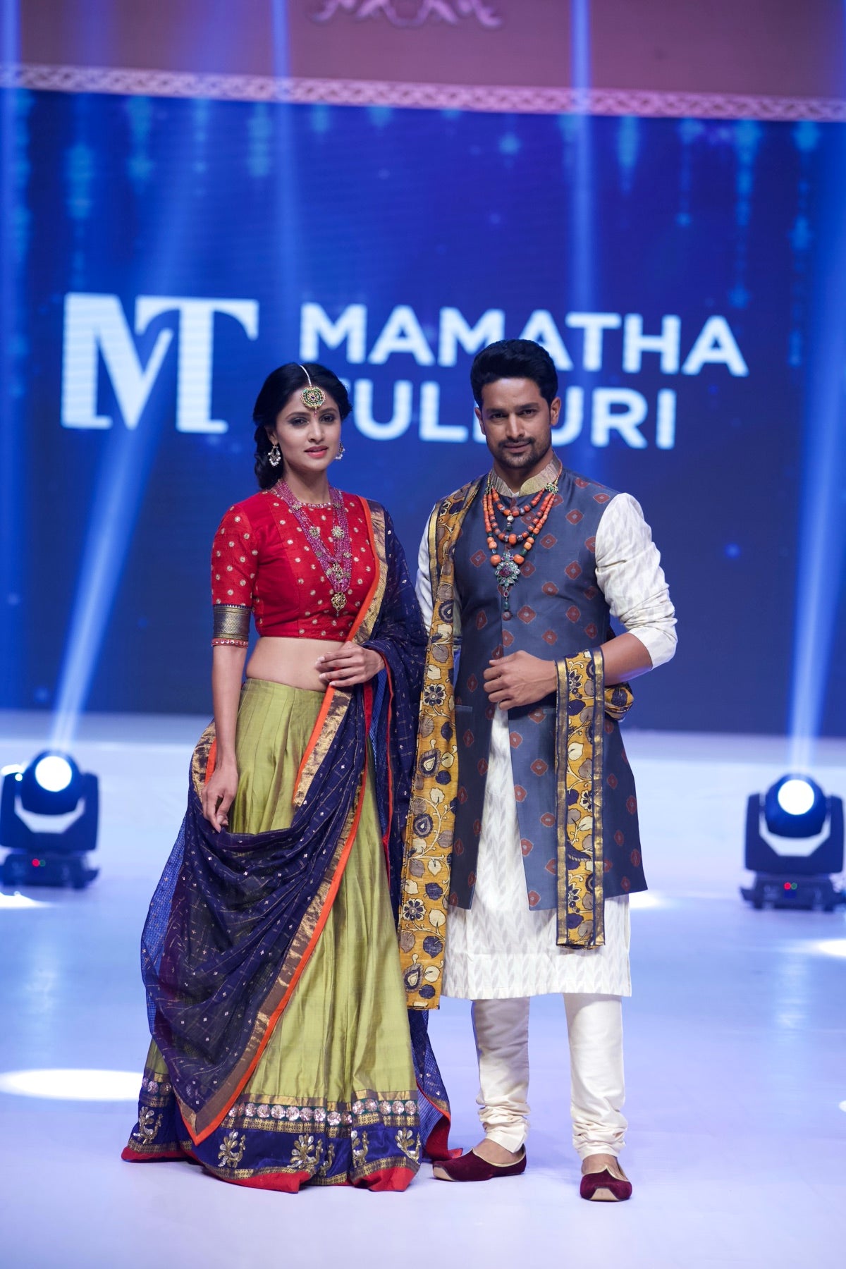 Couple look, red and olive-gold lehenga paired with a navy sherwani